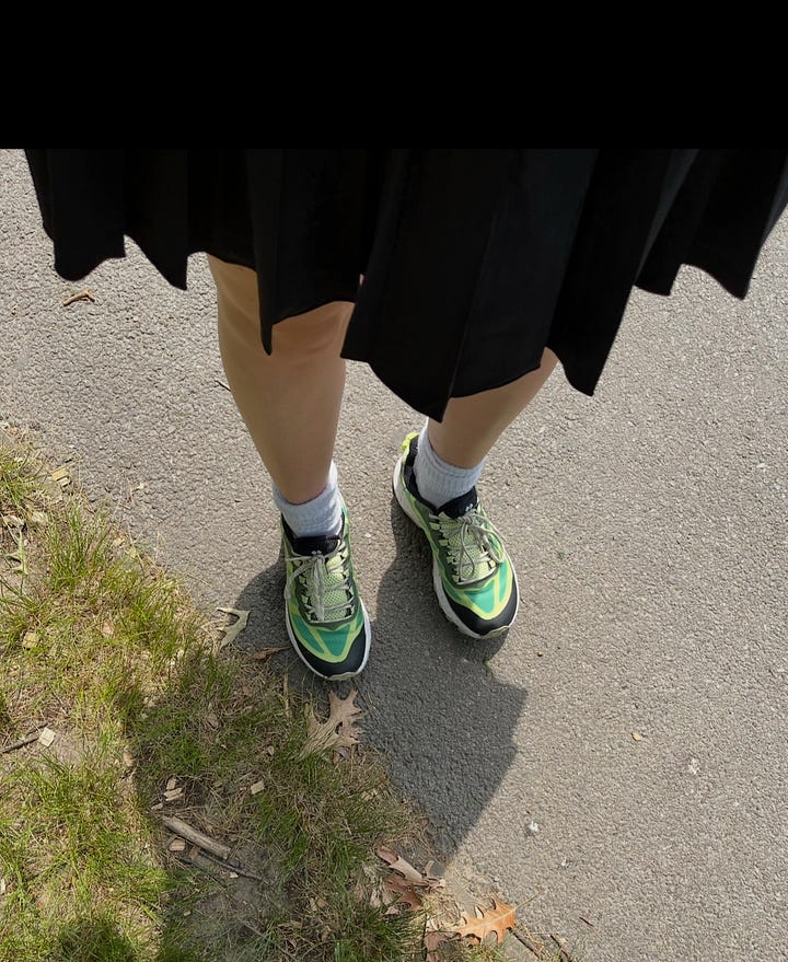 woman wearing Merrell x Sweaty Betty Moab Speed Sneakers in green.