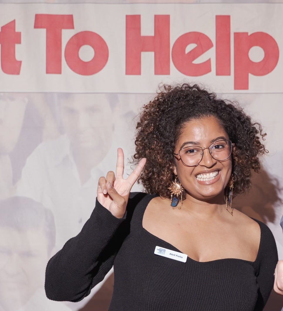 Close up of young woman, big smile, and holding fingers in victory sign