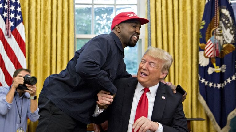 kanye west giving donald trump awkward hug at white house kanye west giving donald trump awkward hug at white house