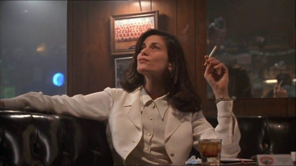 A person smoking a cigarette

Description automatically generated