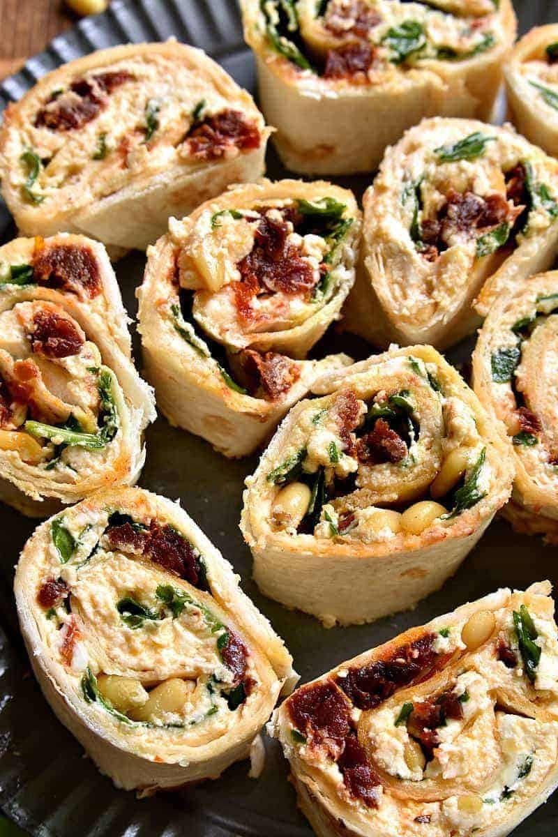 These Spinach Goat Cheese Sun Dried Tomato Pinwheels are the perfect appetizer! Packed with delicious flavor and SO easy to make, they're ideal for cocktail parties, picnics, ladies nights, or even dinner!