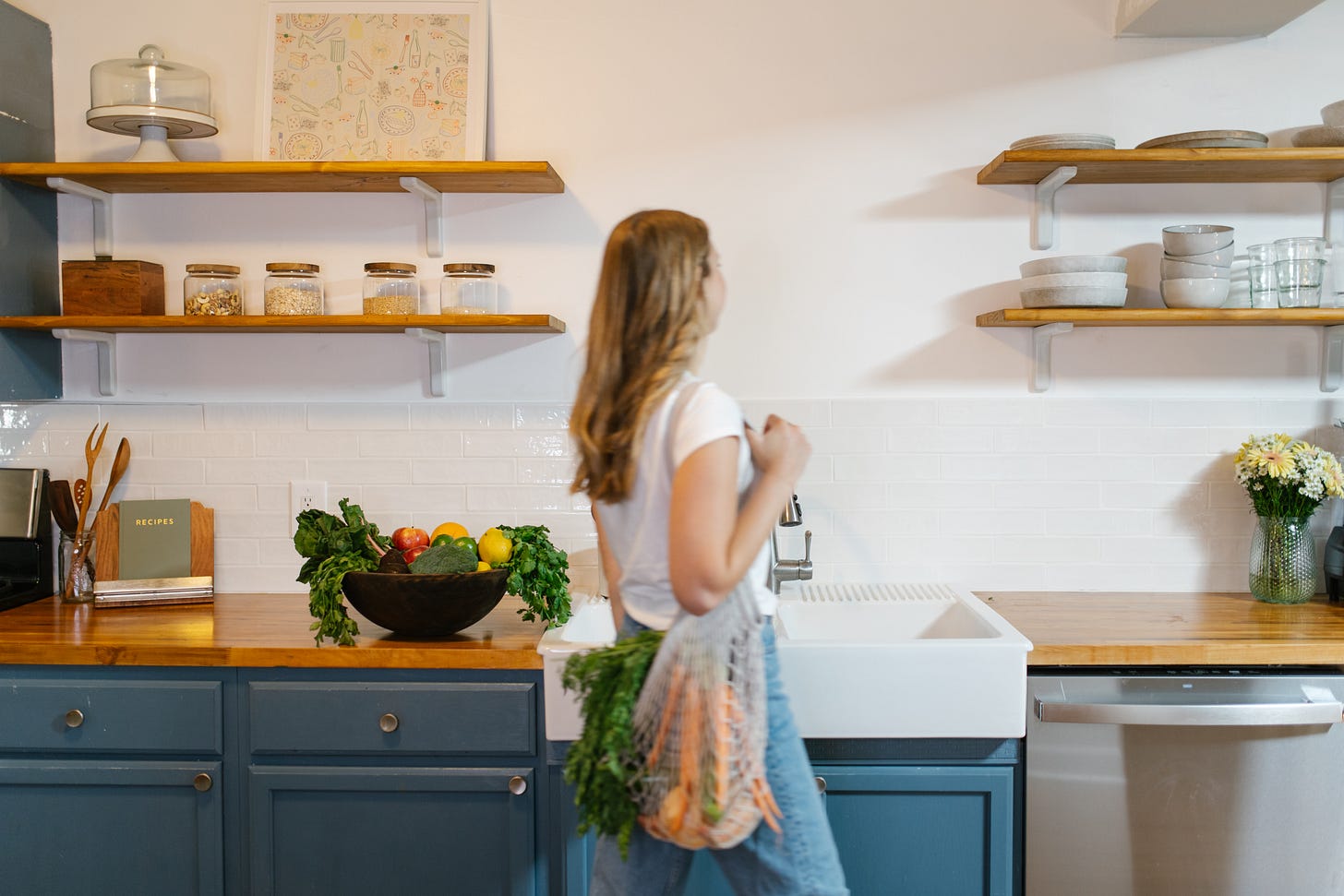 girl in the kitchen with grocery bag