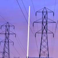 Capacitive coupling from high-voltage power lines can light a lamp continuously at low intensity.