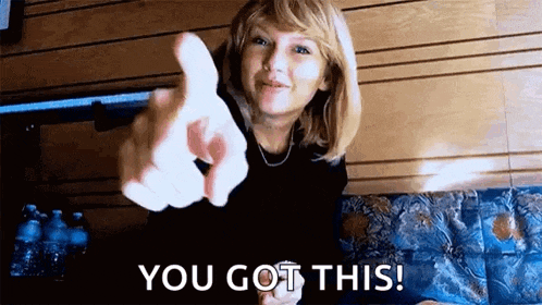 taylor swift is pointing at the camera and saying `` you got this ! ''