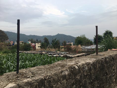 various cities, buildings, hills, lakes with boats, wild rivers, a stupa, the countryside, and the "view" of the Annapurna mountain range