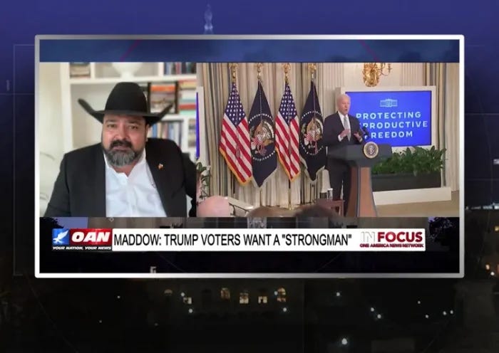 Video still from In Focus on One America News Network during an interview with the guest, Burt Thakur.
