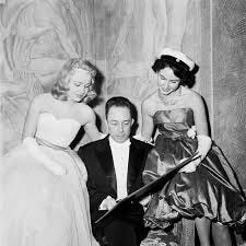 Albert Camus speaking to two women at the Nobel Banquet at the Stockholm  City Hall on 10 December 1957. Albert Camus was awarded the 1957  #NobelPrize in Literature "for his important literary