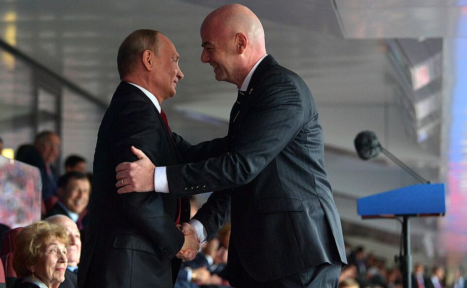 Vladimir Putin and Gianni Infantino at the opening ceremony of the 2018 FIFA World Cup in Russia. Vladimir Putin and Gianni Infantino at the opening ceremony of the 2018 FIFA World Cup in Russia.
