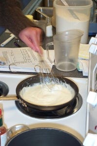 Making a white sauce in a saute pan invites a spill!