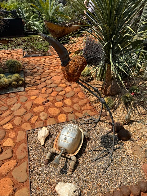 Nine images of sculpture placed within the cactus garden Vives Verde.
