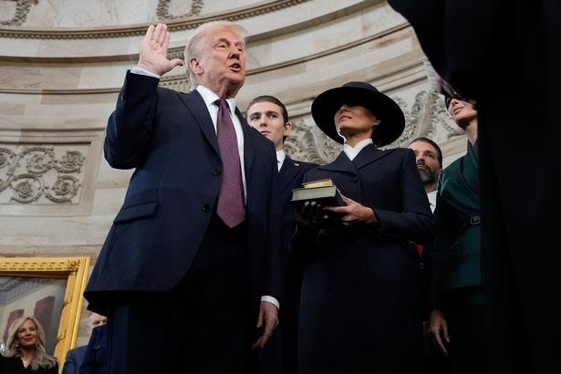 Donald Trump is sworn in as the 47th president of the United States by Chief Justice John Roberts as Melania Trump holds the Bible during the 60th Presidential Inauguration