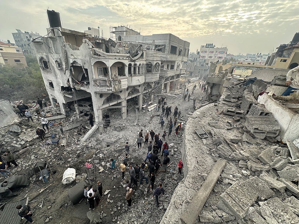 A view of damage at the residential building of Palestinian Aloush family following a fresh Israeli airstrike on Jabalia after Israel and Gaza reached a ceasefire agreement