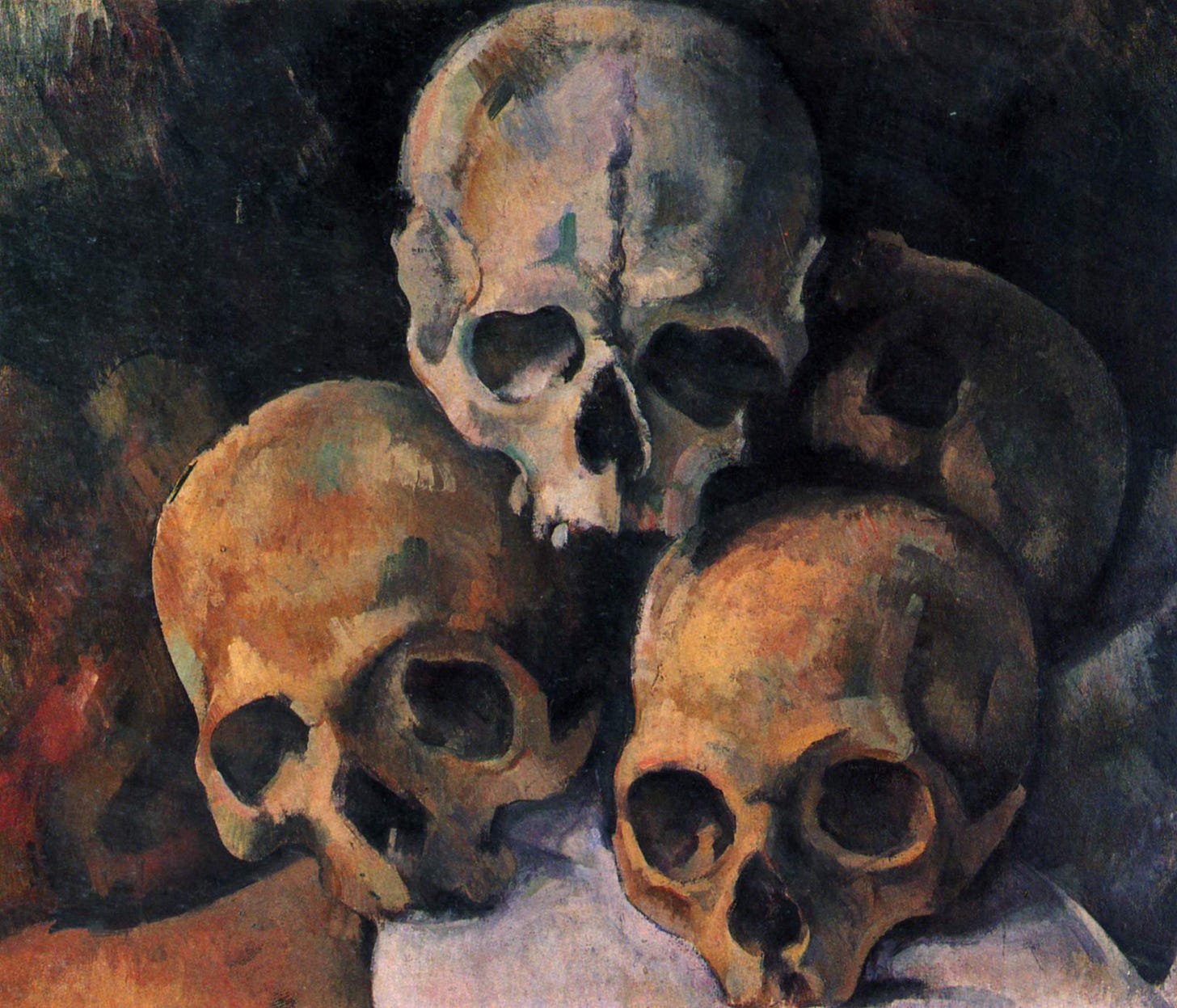 Four human skulls stacked in a pyramid Four human skulls stacked in a pyramid