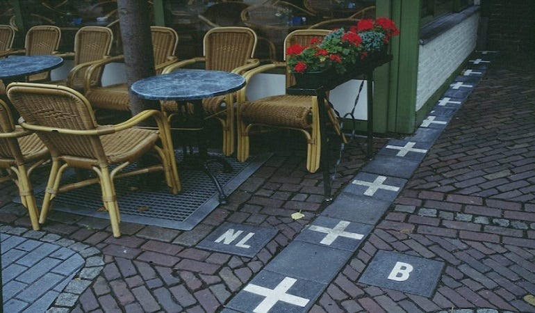 Belgium-Netherlands border through a cafe (Twitter)