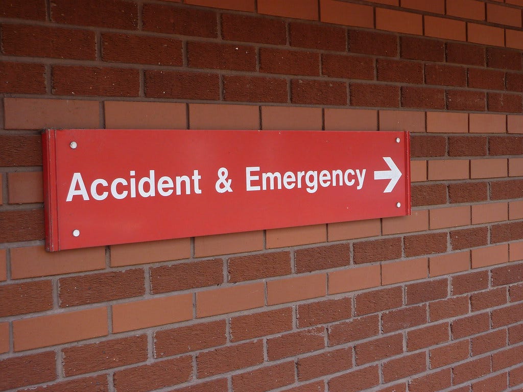 Photo of a sign pointing to Accident & Emergency department