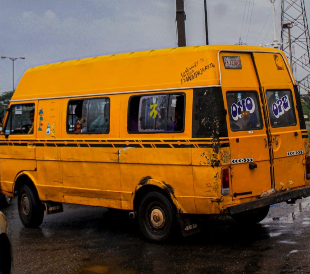 a yellow van driving down a street next to power lines a yellow van driving down a street next to power lines