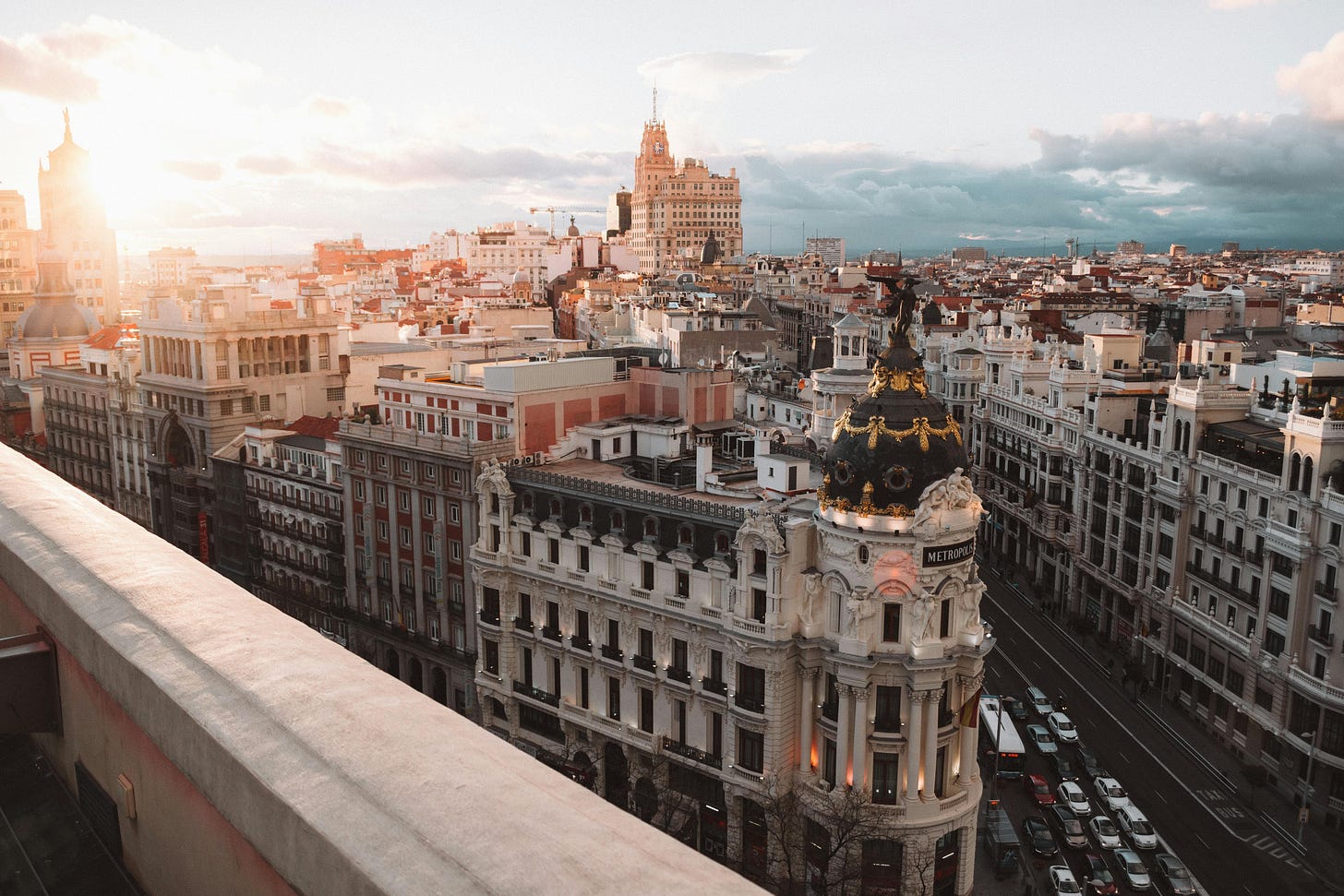 Photo of Madrid Gran Vía from rooftop with sunrise Photo of Madrid Gran Vía from rooftop with sunrise
