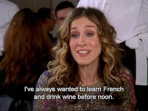 This may contain: a woman sitting in front of a group of people with a quote on her face