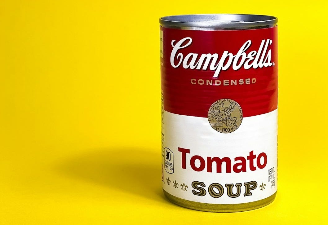 a can of soup on a yellow background