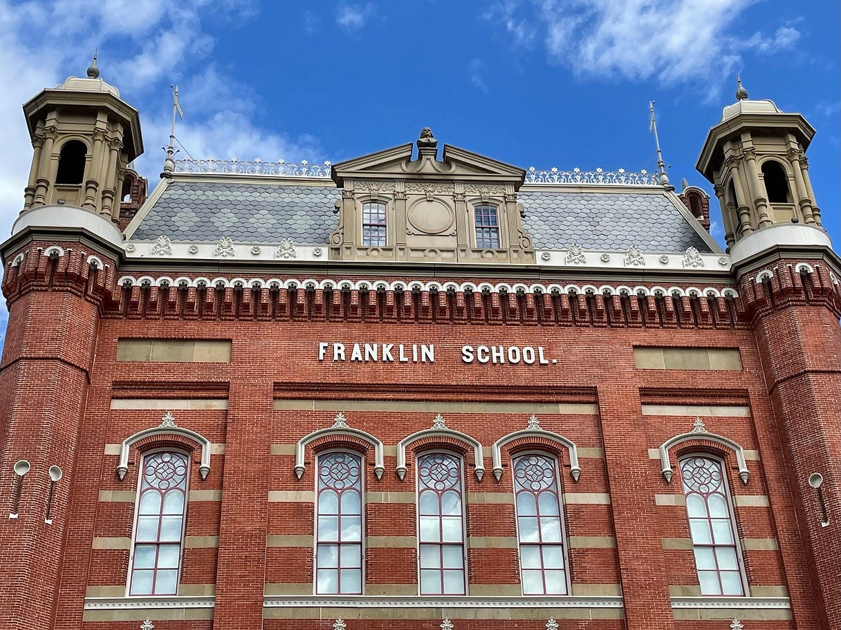 Front facade of Planet Word Museum located in the old Franklin School. A museum that will spark your curiosity!