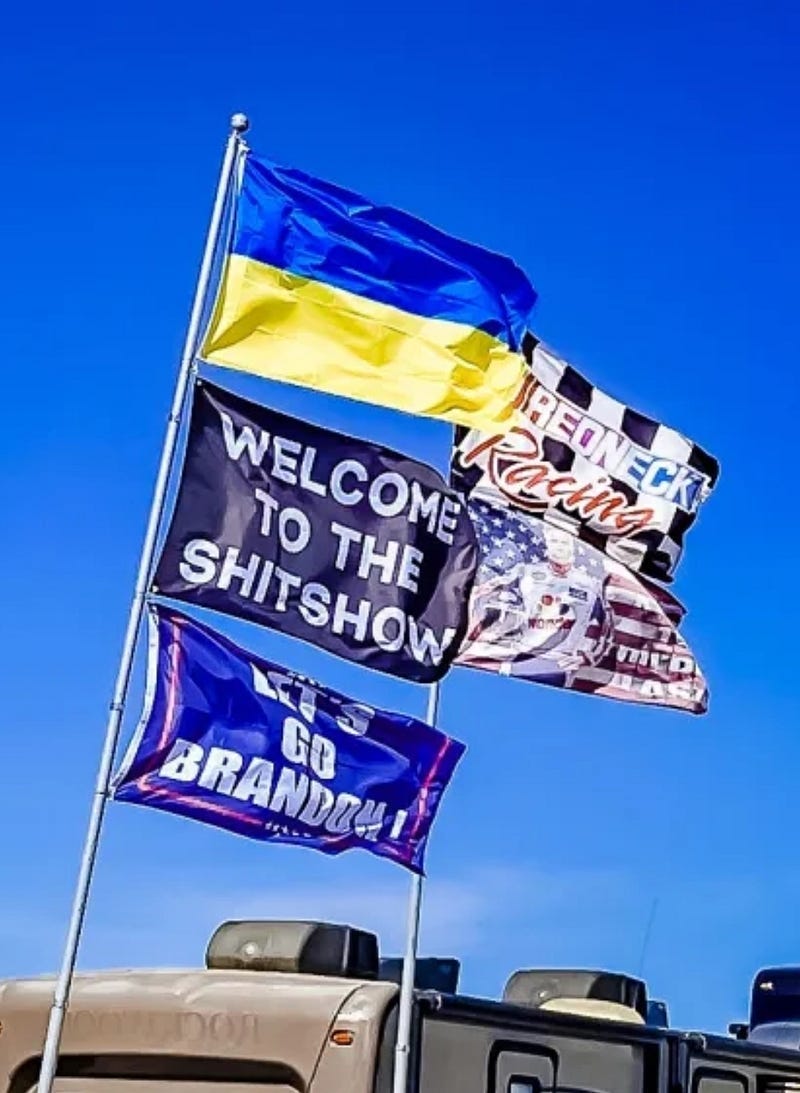 Ukraine and Let’s Go Brandon flag on same pole. Ukraine and Let’s Go Brandon flag on same pole.