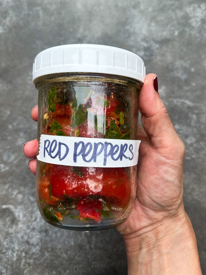 Sweet roasted red peppers marinated with garlic, herbs, and olive oil. An easy make-ahead recipe for sandwiches, salads, and snack boards. Full recipe on Shutterbean. Sweet roasted red peppers marinated with garlic, herbs, and olive oil. An easy make-ahead recipe for sandwiches, salads, and snack boards. Full recipe on Shutterbean.