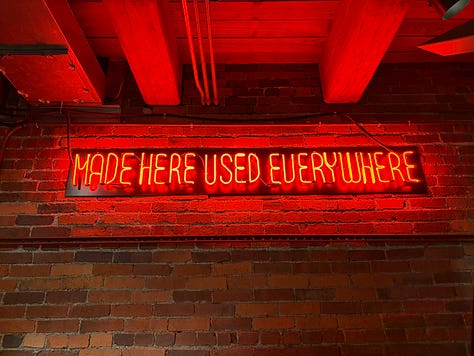 bottles, glassware, neon sign, exhibits, displays