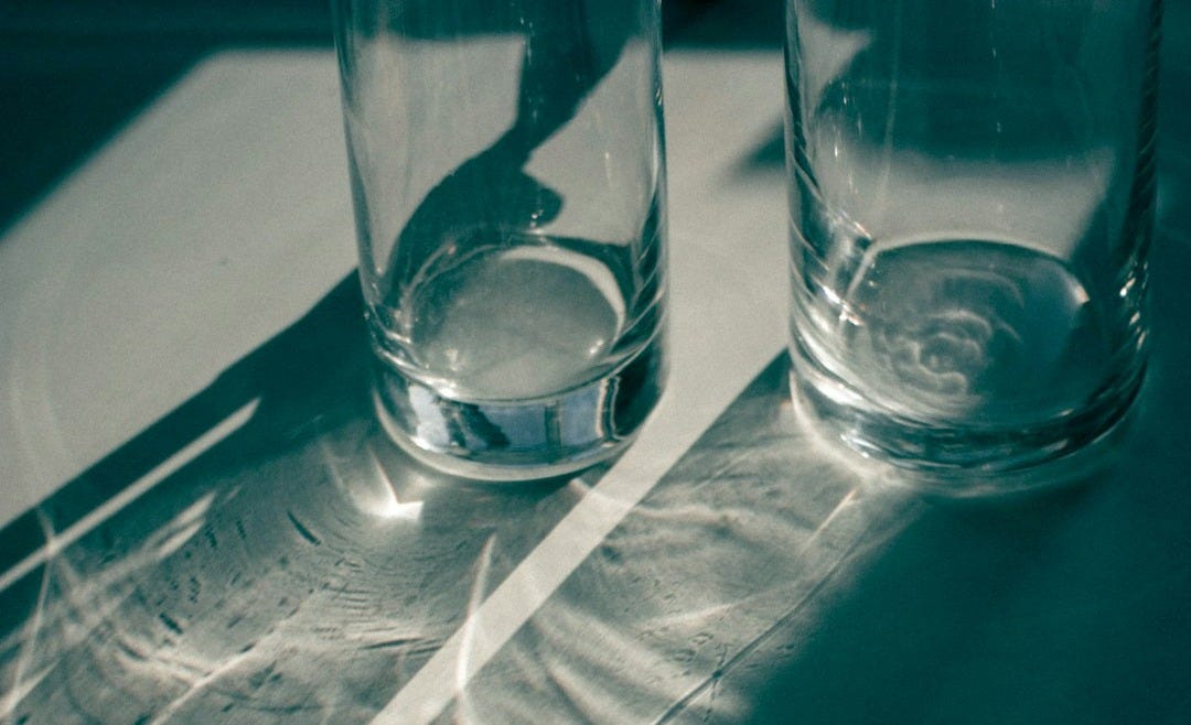 clear drinking glass on white table