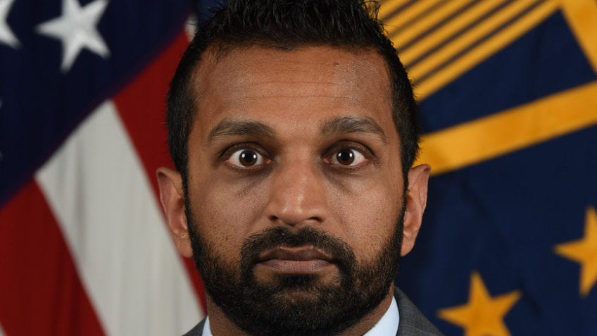 Kash Patel's unintentionally-hilarious official photo from his previous Trump job, in which he appears bug-eyed and crazed. Kash Patel's unintentionally-hilarious official photo from his previous Trump job, in which he appears bug-eyed and crazed.