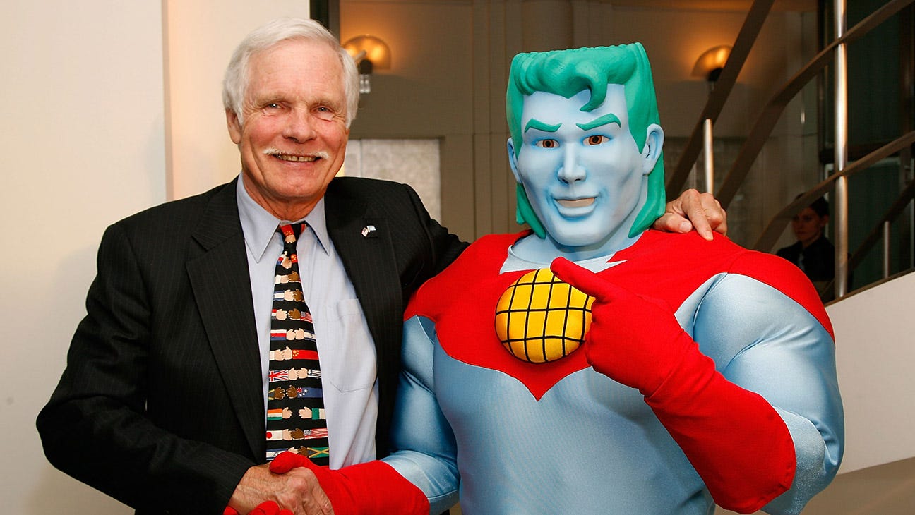 Ted Turner poses for a photo with Captain Planet at the Captain Planet Goes Green NYC reception party hosted by Ted Turner on April 24, 2008 in New York City.