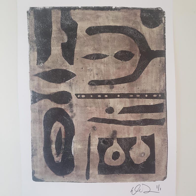 May include: Abstract print with a beige background and black shapes. The artwork features a variety of geometric and organic forms, including ovals, lines, and dots. The print is signed in the bottom right corner.