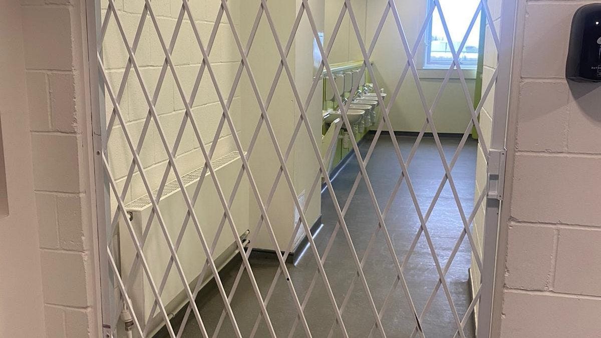 <p>The metal gates preventing access to the toilets</p>