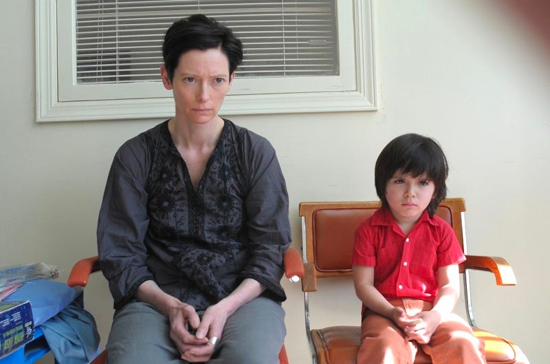 Kevin looking angry while his mom sits there looking annoyed