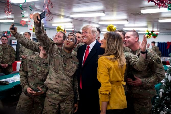 White House says it didn't distribute MAGA hats Trump signed in Iraq,  Germany | CNN Politics