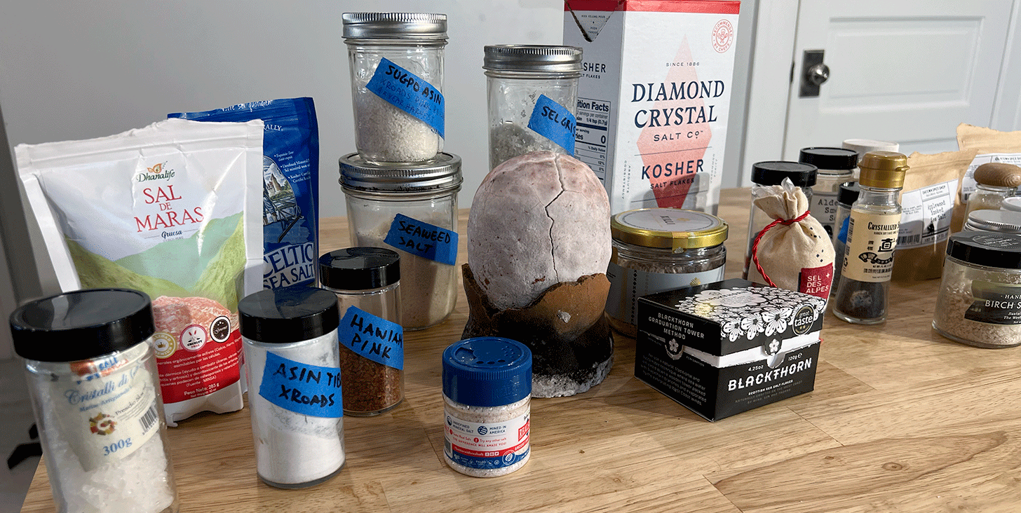 many jars of salt on a counter top