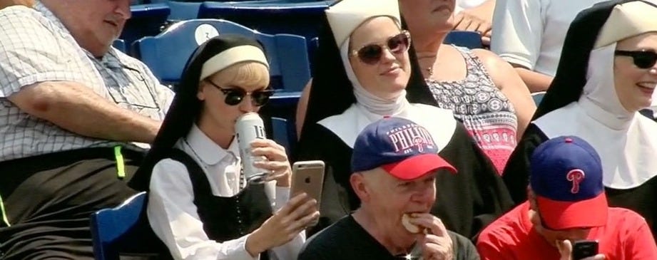 THE HOT NUN DRINKING A MILLER LITE AND TAKING SELFIES AT THE PHILLIES GAME IS NOT REAL - Crossing Broad THE HOT NUN DRINKING A MILLER LITE AND TAKING SELFIES AT THE PHILLIES GAME IS NOT REAL - Crossing Broad