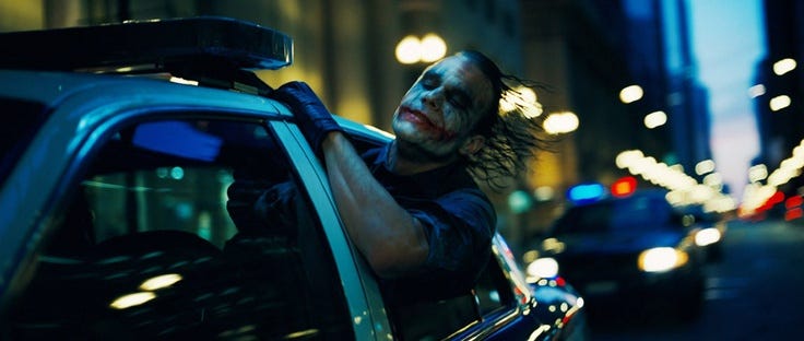 This may contain: the dark knight rises and it looks like he is driving