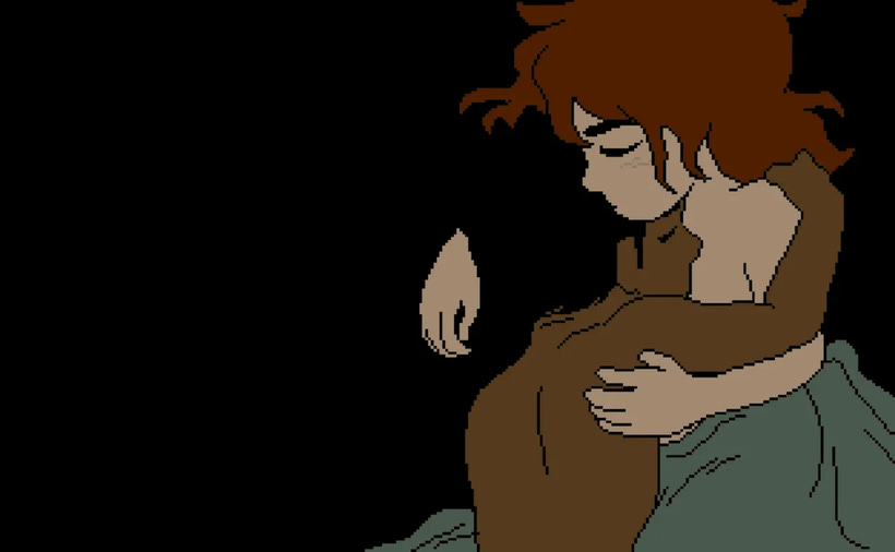A college-aged couple holds one another in bed. A college-aged couple holds one another in bed.