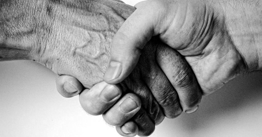 person holding babys hand