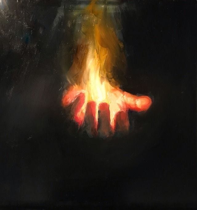 This may contain: a hand is lit up in the dark with fire coming out of it's palm This may contain: a hand is lit up in the dark with fire coming out of it's palm