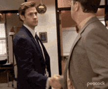 Awkward handshake symbolizing uneasy agreement in early-stage deals Awkward handshake symbolizing uneasy agreement in early-stage deals