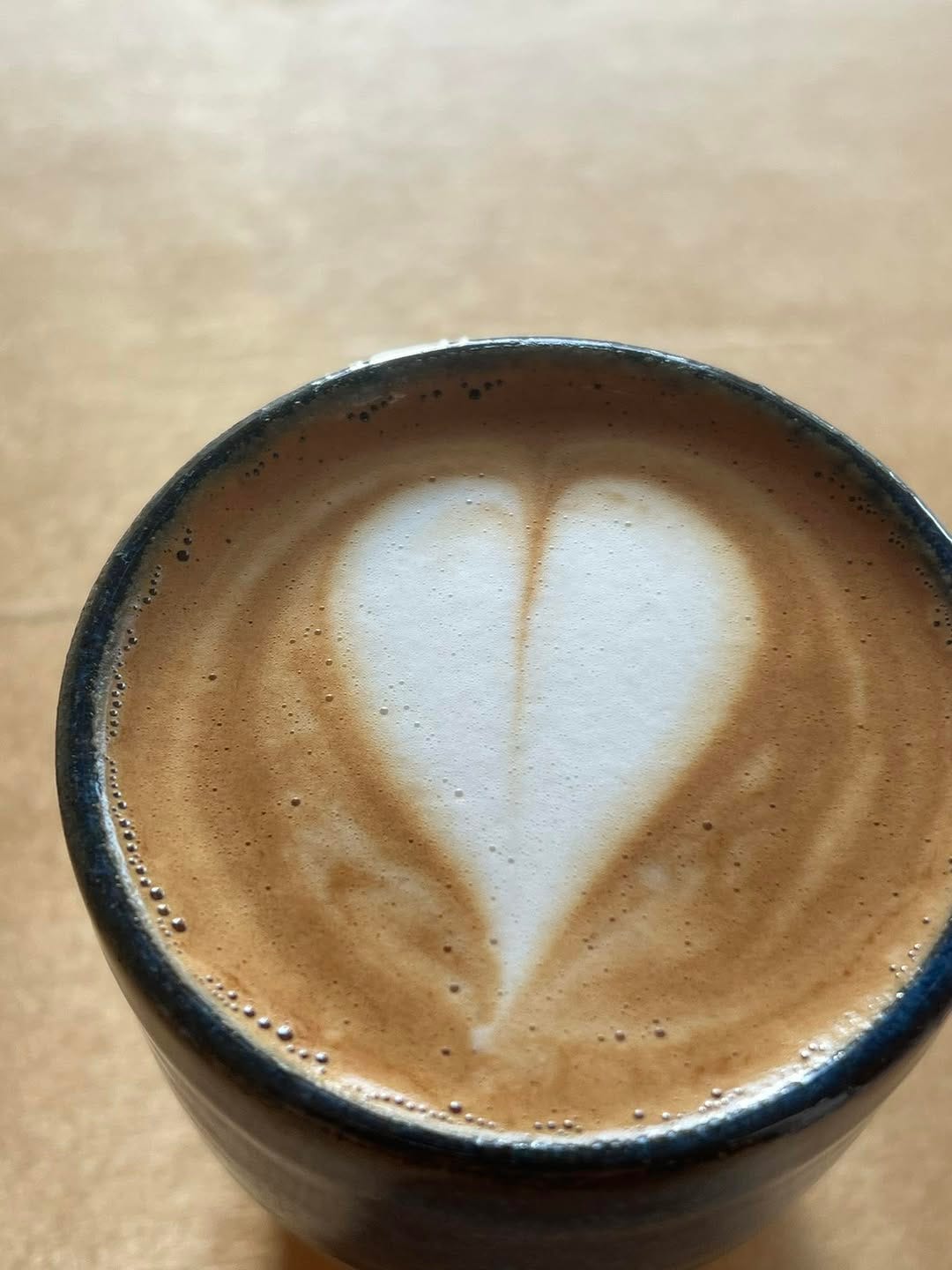 May be an image of coffee cup, heart and coffee
