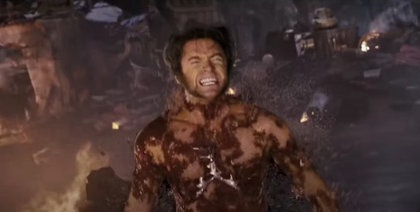 Wolverine screams as Dark Phoenix burns away much of the flesh from his chest and shoulders. Wolverine screams as Dark Phoenix burns away much of the flesh from his chest and shoulders.