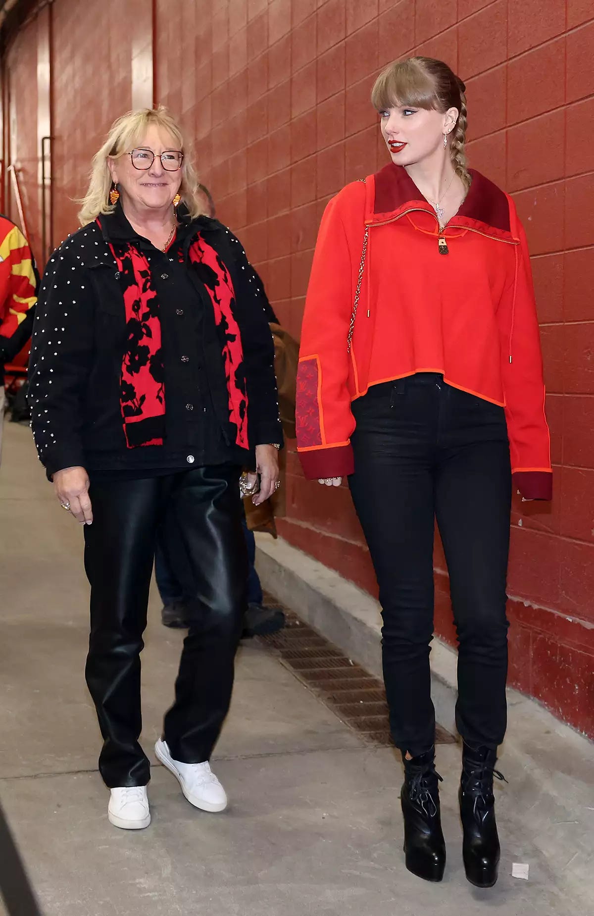 Singer Taylor Swift walks into the stadium alongside Donna Kelce prior to the game between the Las Vegas Raiders and the Kansas City Chiefs at GEHA Field at Arrowhead Stadium on November 29, 2024 in Kansas City, Missouri. 