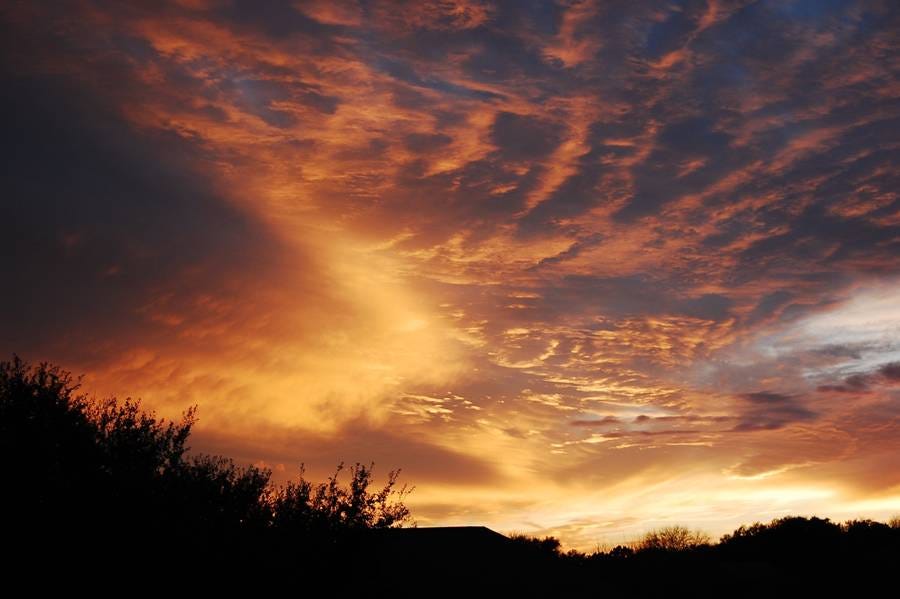 A sunset with clouds and trees

AI-generated content may be incorrect.