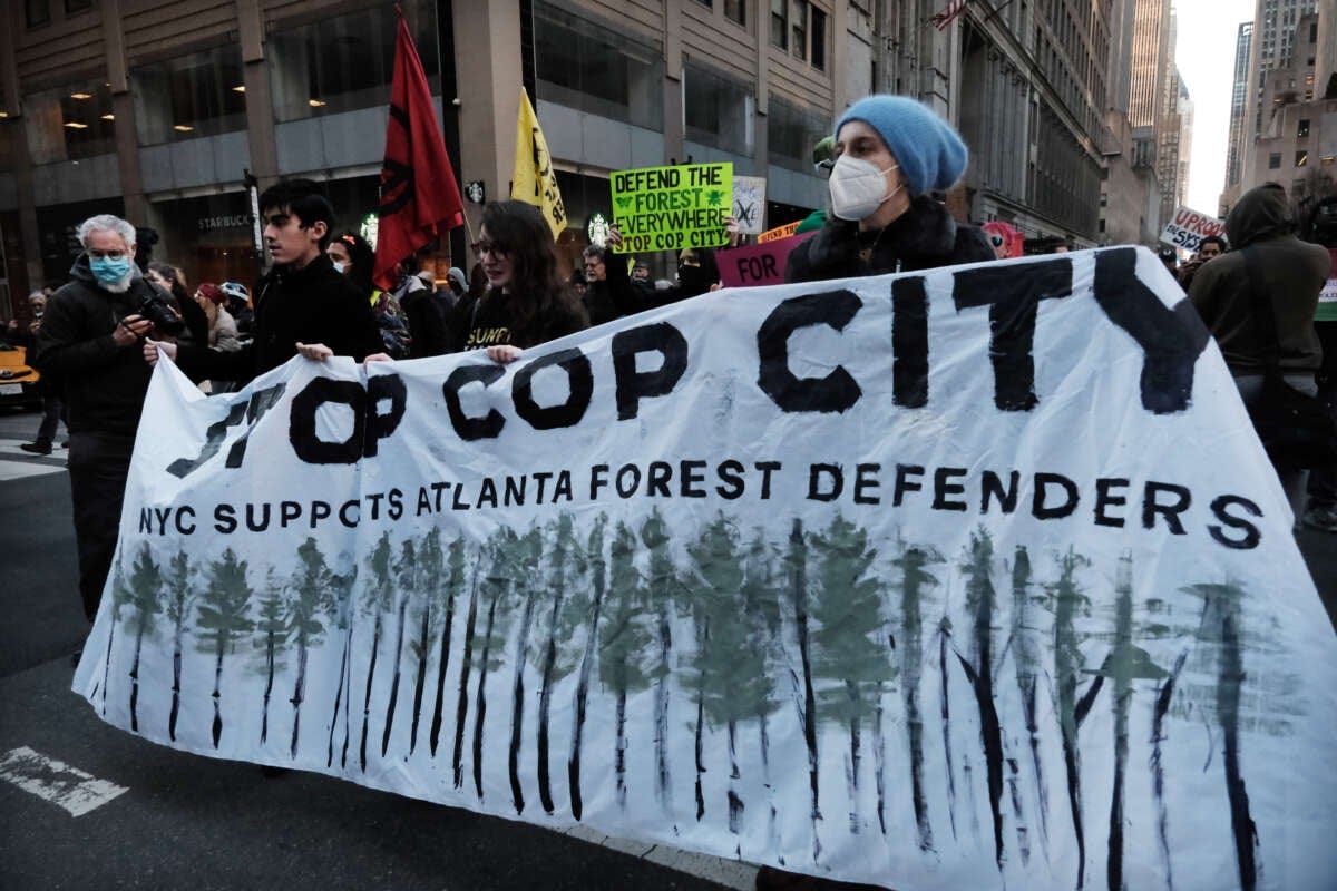Activists participate in a protest against the proposed Cop City being built in an Atlanta forest on March 9, 2023 in New York City.