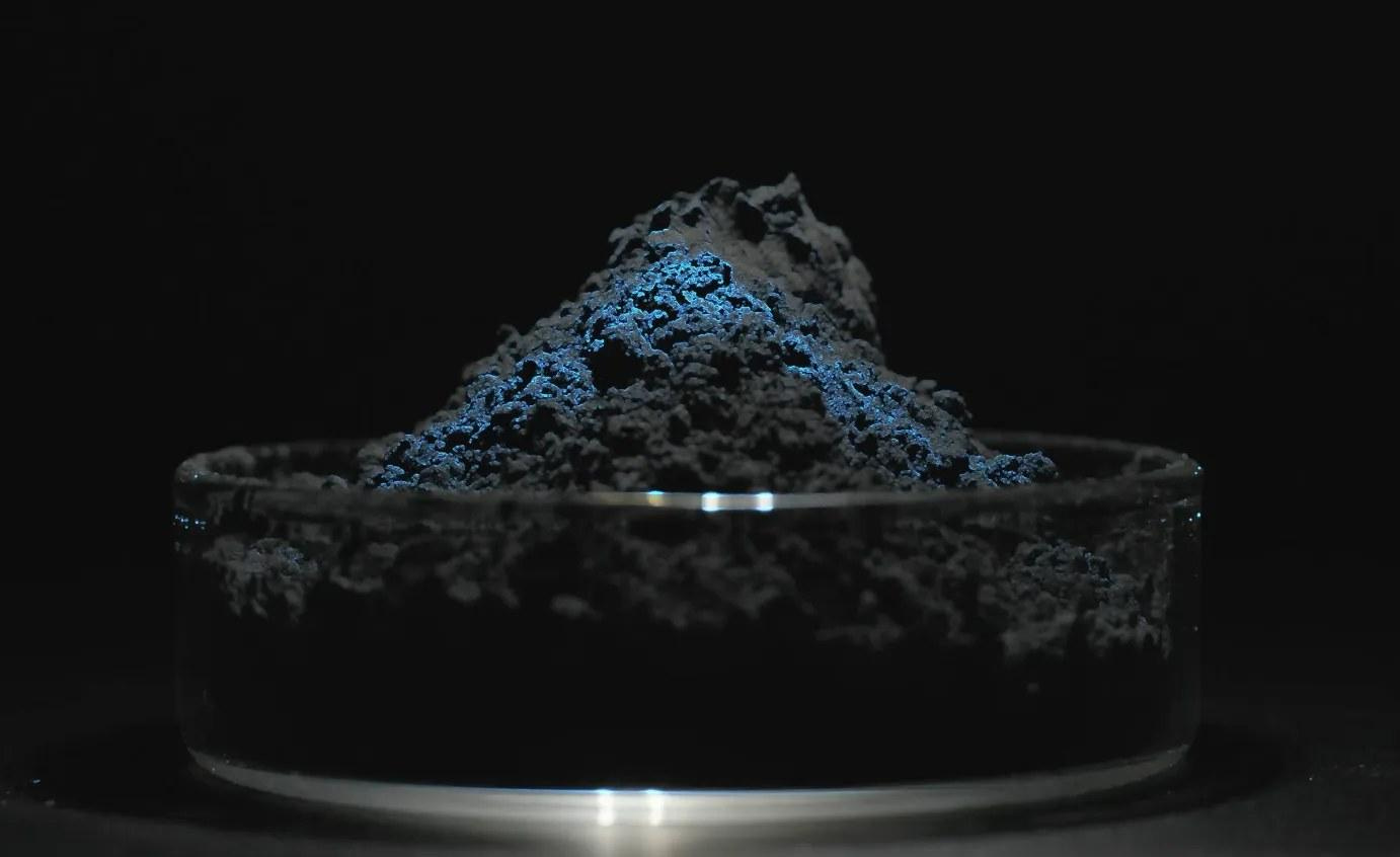 A dish of dark grey sodium iron sulfate cathode powder