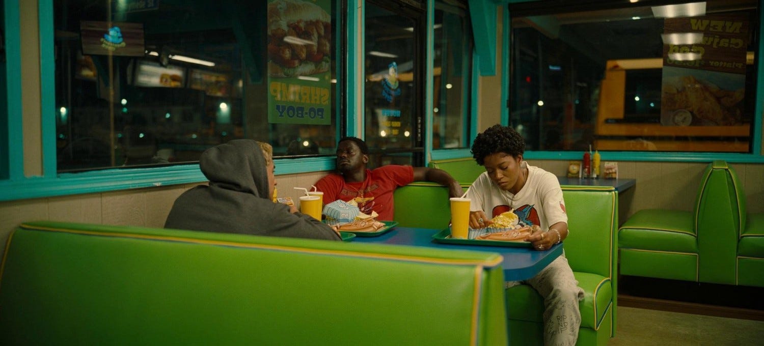 Screenshot from "Nope." The three heroes have dinner in a colorful diner and (mostly) try not to think about earlier events.