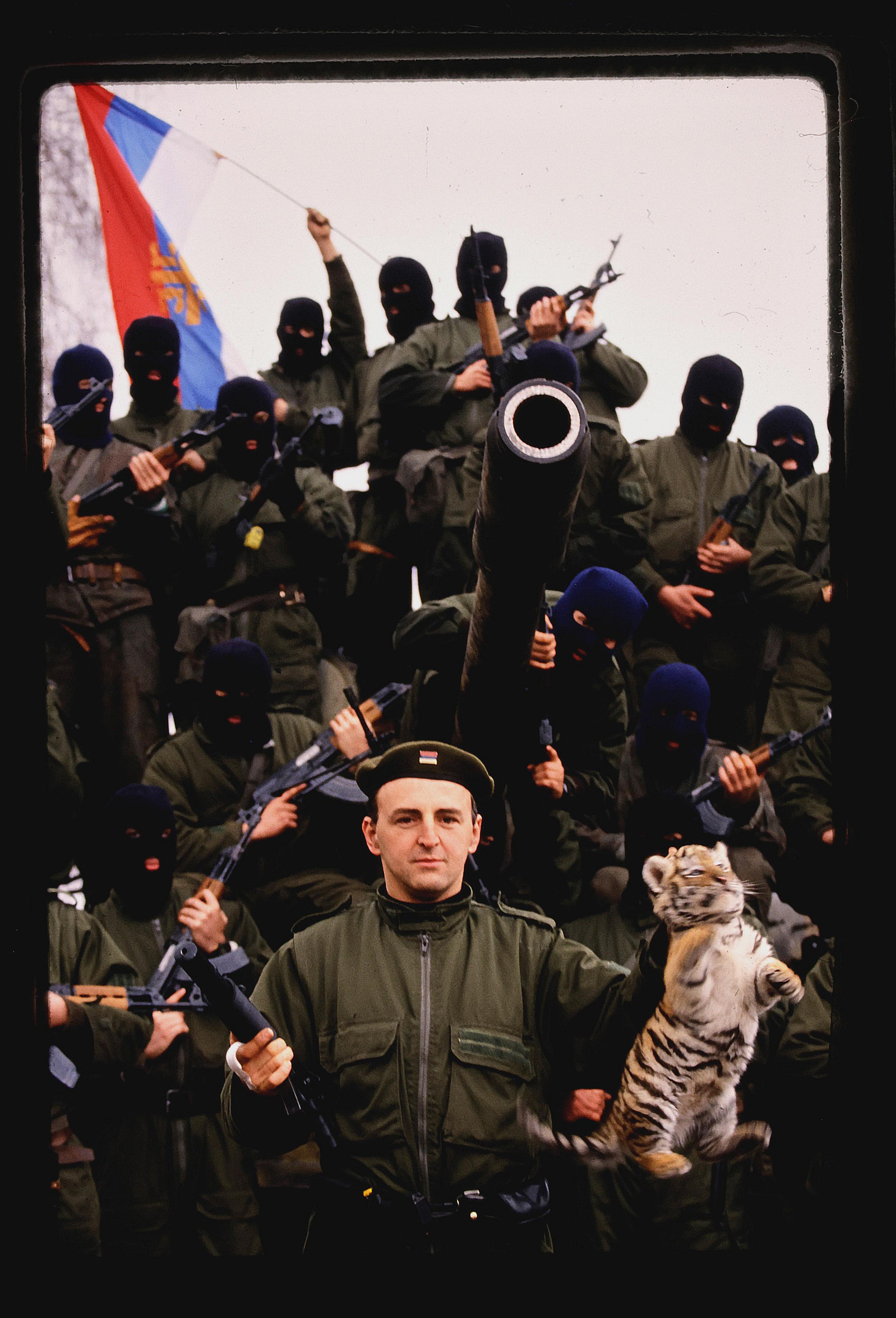 Serbian mobster and warlord Željko Ražnatović, known as "Arkan," holding a baby tiger in 1991. His unit, the Serb Volunteer Guard, was notorious for war crimes, and Ražnatović himself was one of Serbia's most feared figures, escaping jail twice before his assassination in 2000.