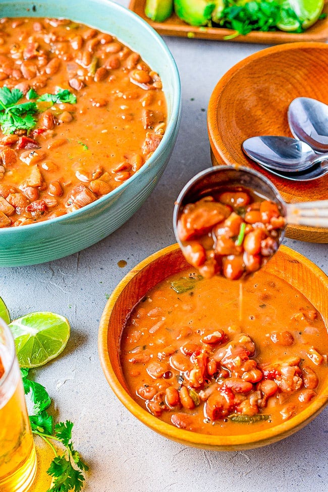 Borracho Beans - These “drunken beans” are simmered with a can of BEER and can be made in your SLOW COOKER OR INSTANT POT! The bacon, sausage or chorizo, jalepenos, tomato, onion, garlic, herbs, and beer make these the BEST beans ever! A wonderful side for any Mexican-themed meal!
